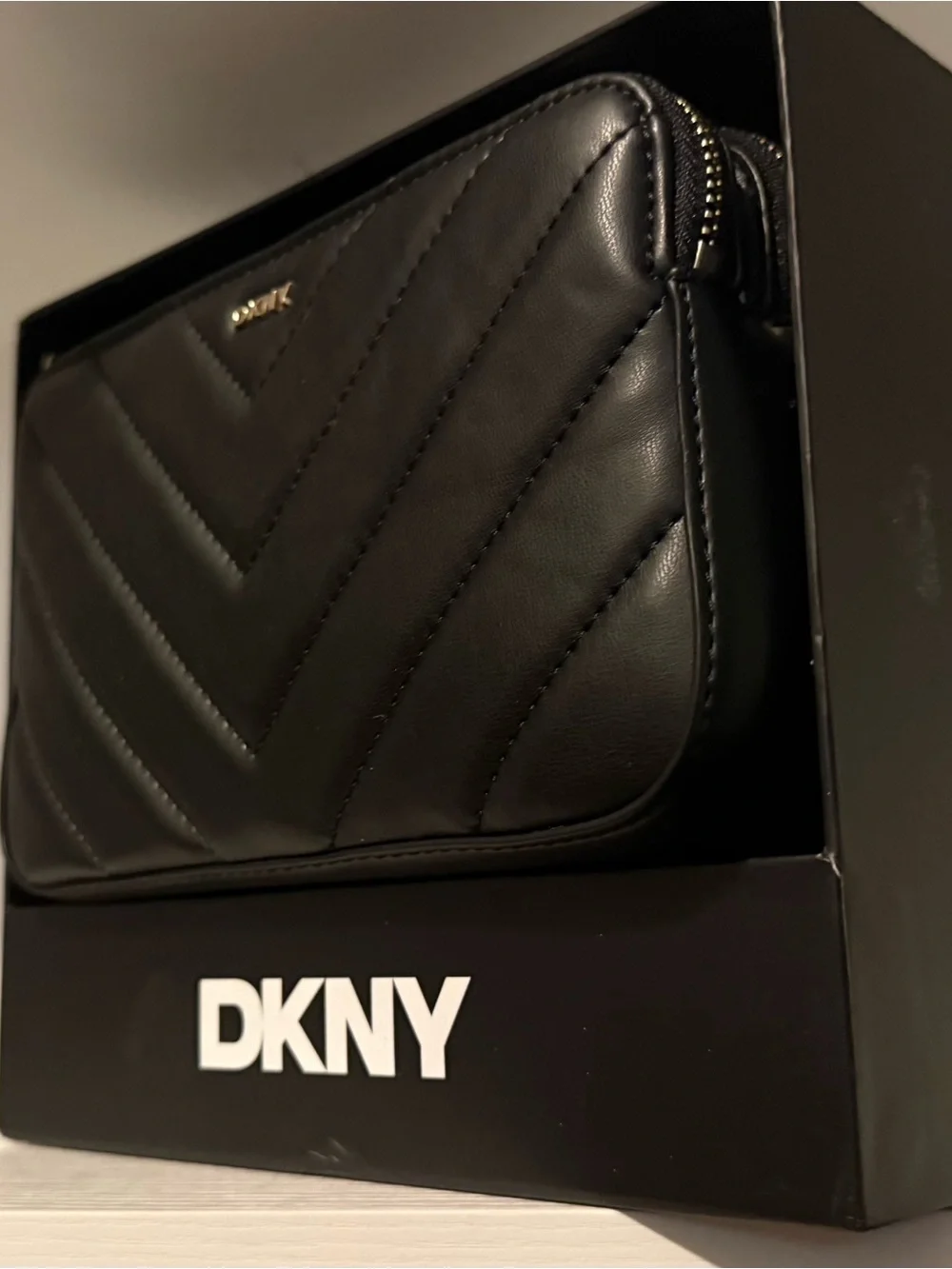 DKNY Black Quilted Chevron Leather Zip Wallet with Gold Logo